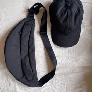 EVERLANE Stylish Black Womens Sling Bag and baseball cap.